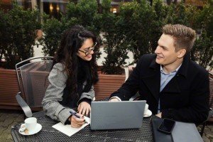 Businessman and woman working at cafe